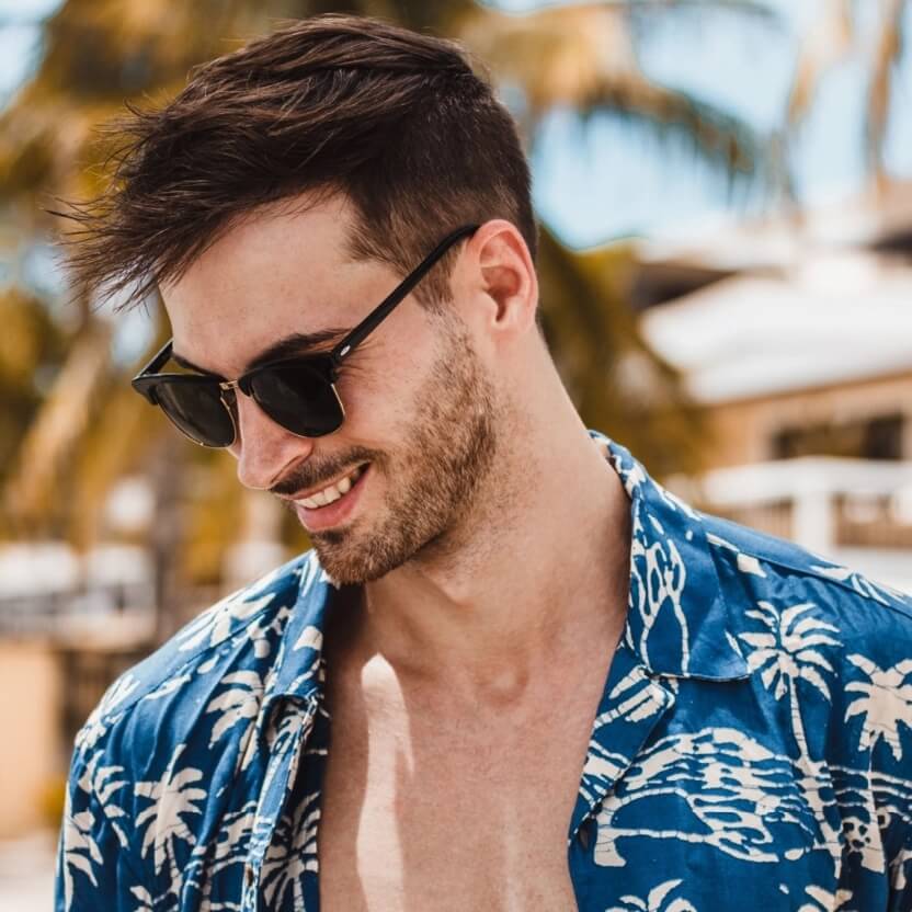 Man with sunglasses and Hawaiian shirt