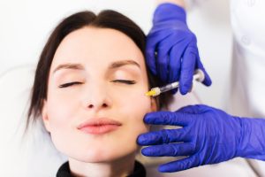 woman getting injections in a cosmetology clinic