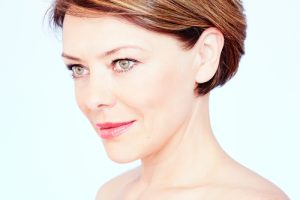 Close up portrait of beautiful middle aged woman with short brown hair
