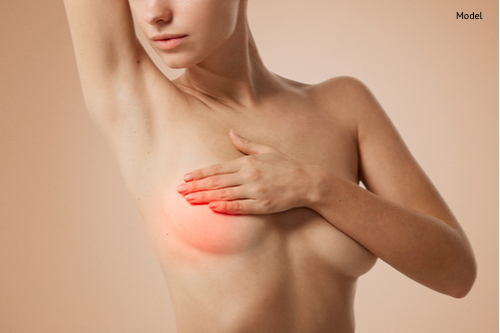 portrait young woman with breast pain touching chest-img-blog